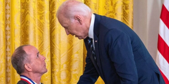 Dr. Rory Cooper hand shaking with Pres. Biden